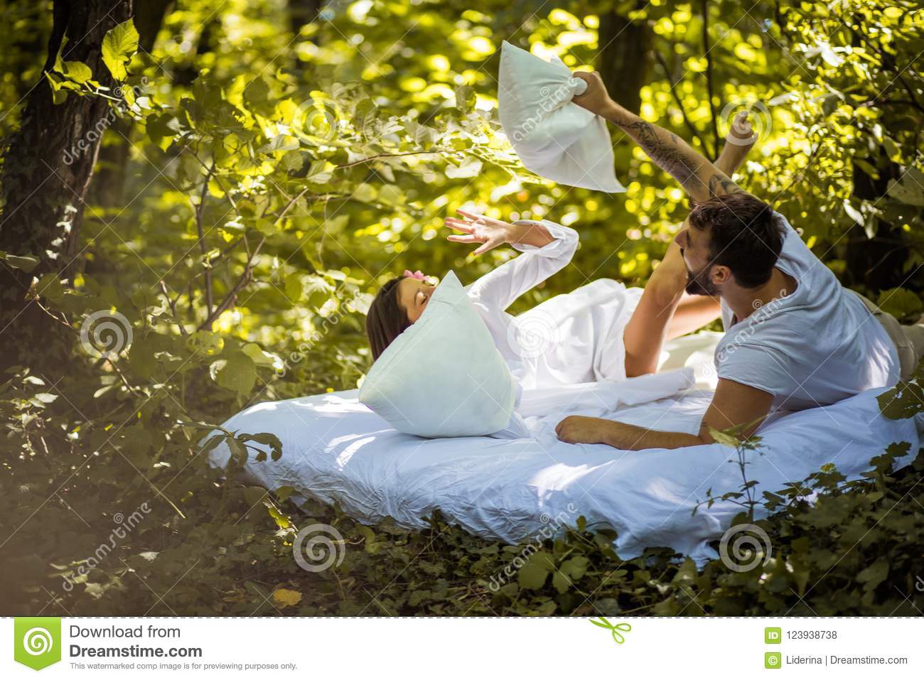 Young couples share a bed