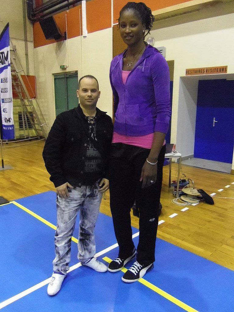 Tall black women short man