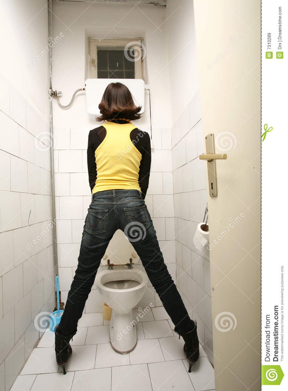 Standing and peeing on the floor